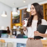 Portrait,Of,A,Smiling,Asian,Businesswoman,Carrying,Laptop,Computer,And