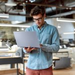 Portrait,Of,Caucasian,Male,Worker,In,Glasses,Wearing,Denim,Shirt