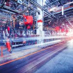 robots welding in a car factory