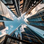 Looking directly up at the skyline of the financial district in central London – stock image